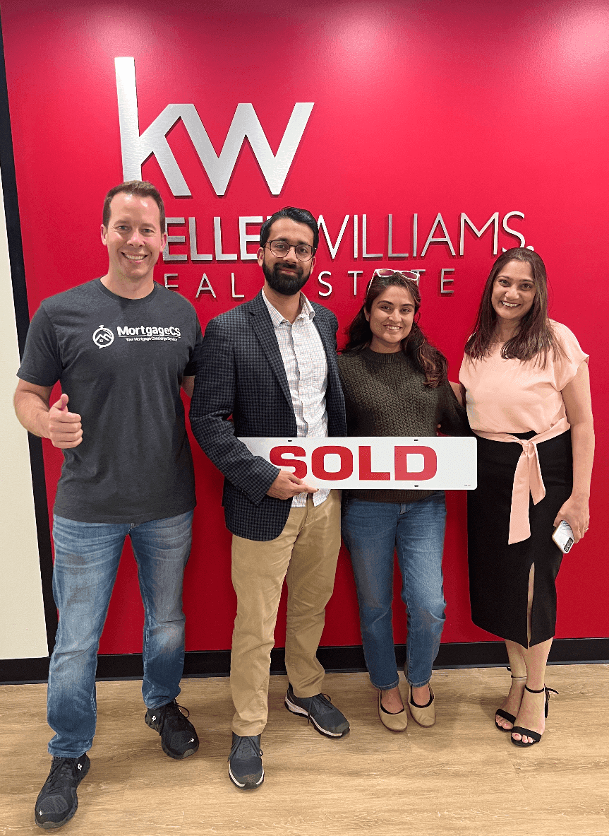 Family receiving keys to their new home after mortgage closing